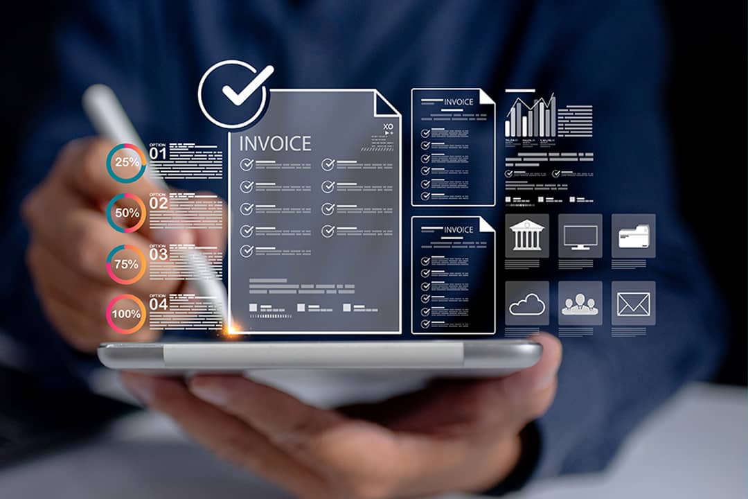 A finance analyst utilizing an automated and central invoice database and related management data charts from a work tablet.